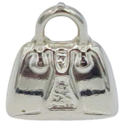 Charm maleta-bolso colgante en plata de ley. Mide 12 mm de ancho. Ideal para combinar con una cadena de plata o colgar de una pulsera de plata.