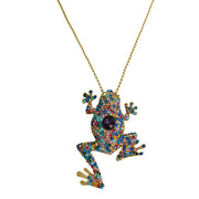 Broche rana colgante de metal dorado y brillantes de strass multicolor. Trasera en color oro viejo con alfiler y seguro.
Puede usarse también como colgante con una cadena ya que lleva una argolla en la parte superior. Mide 8 cm de largo x 5 cm de ancho.