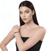 Pulsera de ónix facetado y central de brillantes blancos