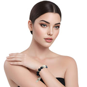 Pulsera de onix facetado negro y bola jade central en blanco